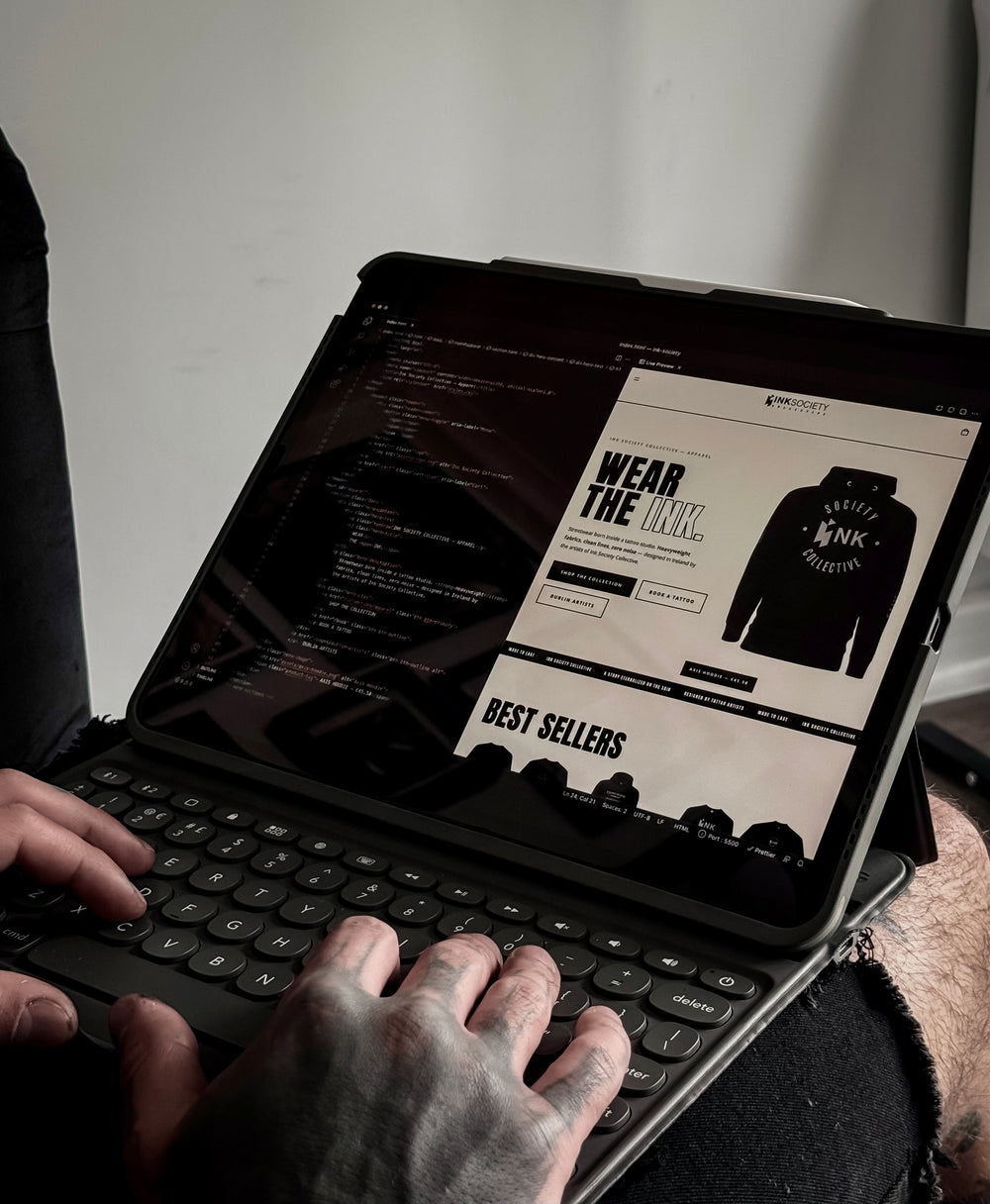 The Ink Society Journal and website being developed on screen.